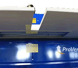 Close-up view of ProVent Uni-Wash dust collection unit with open top panels, showing caution labels and branding for industrial air filtration.