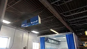ProVent industrial air filtration unit installed on the ceiling of a workshop or manufacturing facility, designed to control dust and airborne particulates in the workspace.